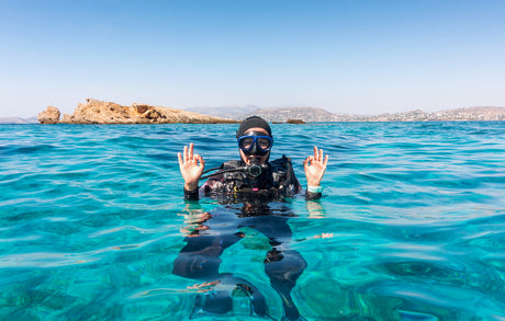 scuba diver giving the okay sign